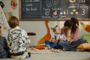 A group of happy toddlers participating in an interactive storytelling circle during a structured afternoon lesson within premium early education programs, demonstrating high-quality language development and peer socialization.