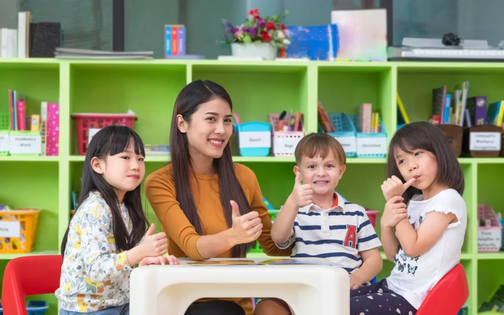 A bright and engaging classroom at KiddieKollege, a premier daycare in Langley, where happy preschoolers are participating in a play-based early learning activity.